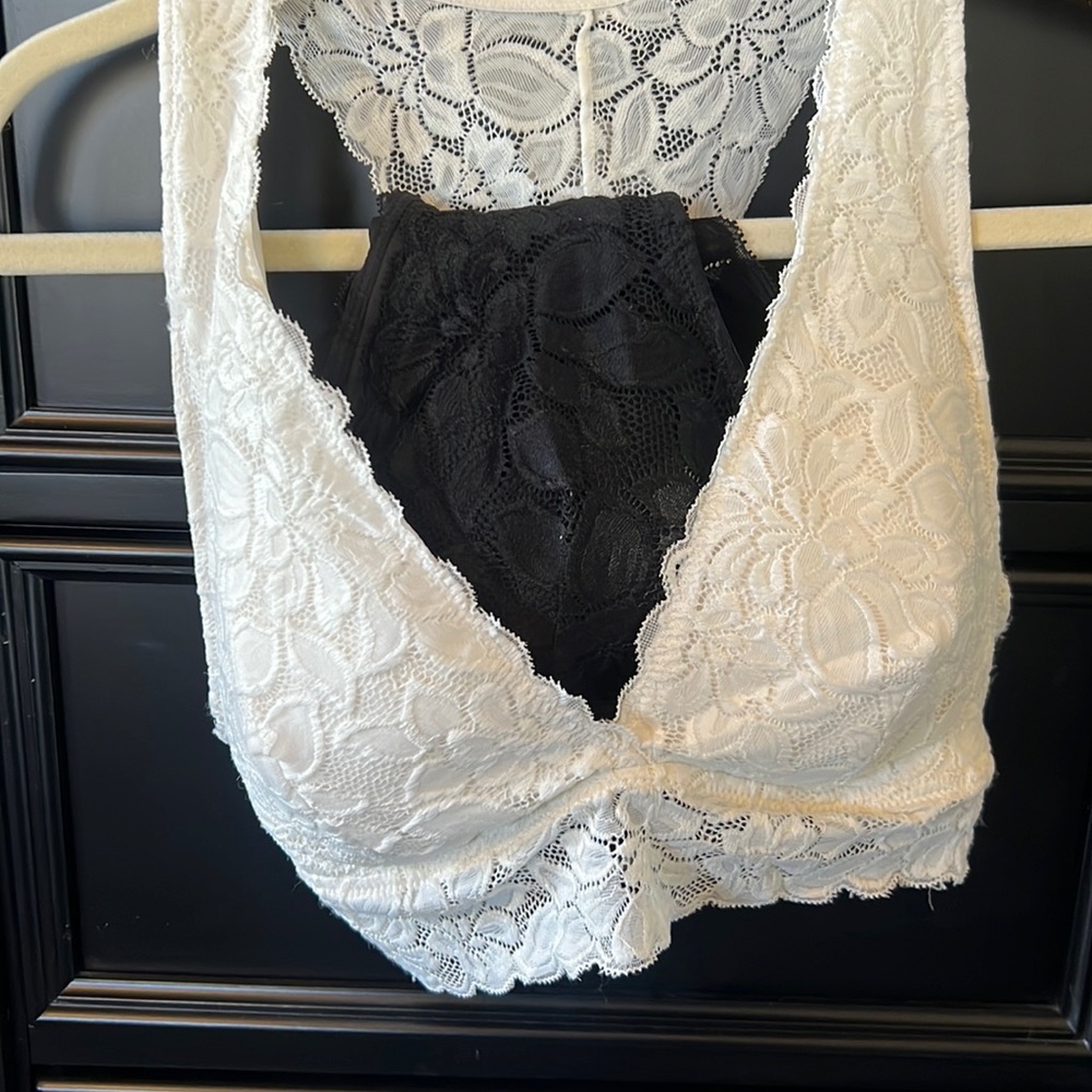 Two: one Cream and one Black soft cup boutique bralettes XL